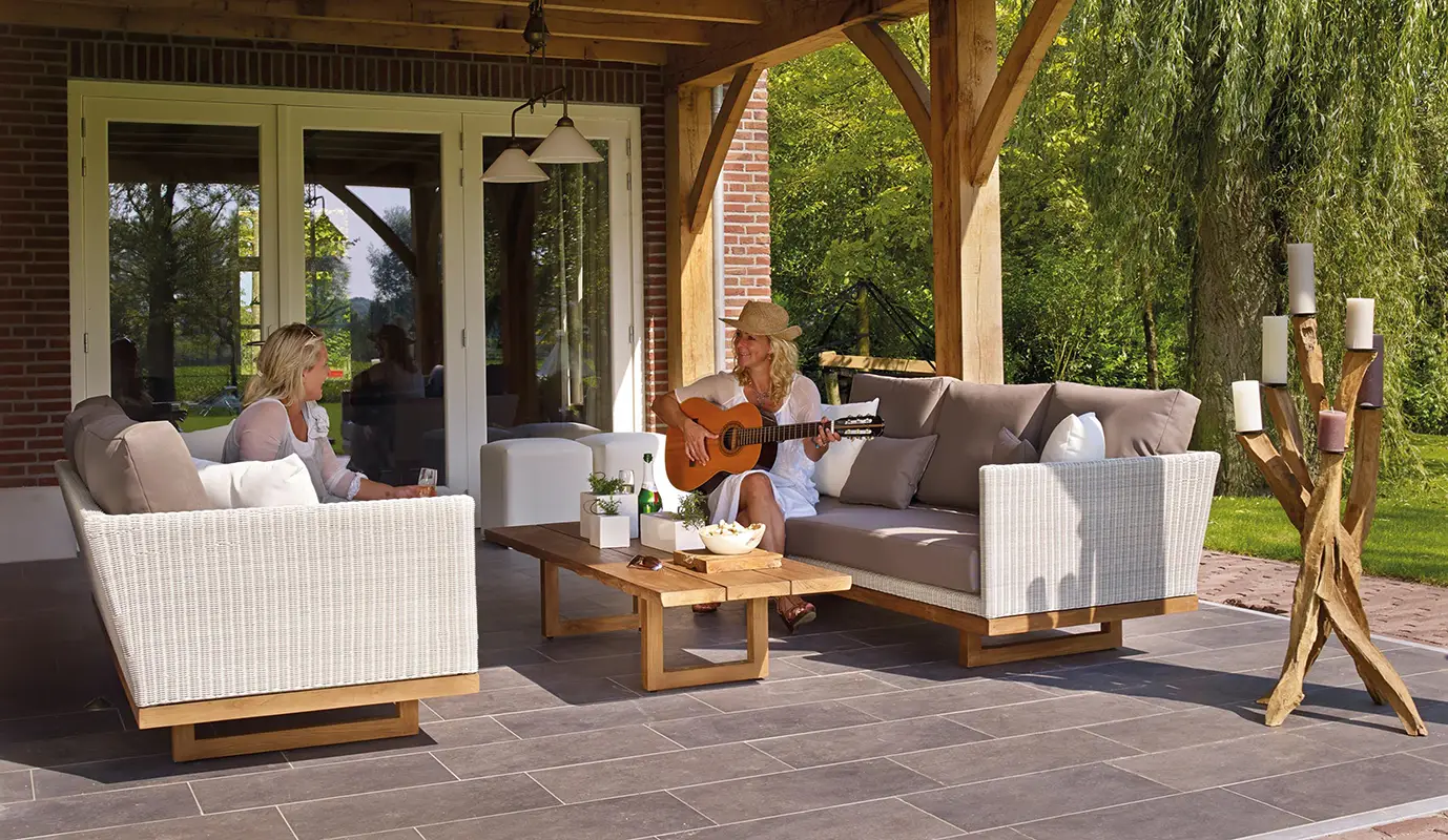 Enjoying a clean patio playing guitar Exterior Cleaning Professionals